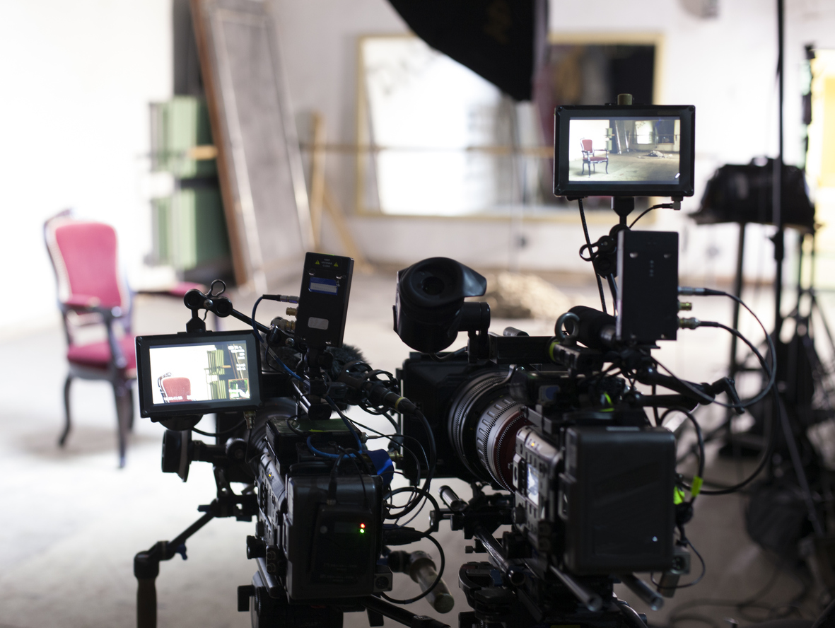 interview video producer setting up cameras